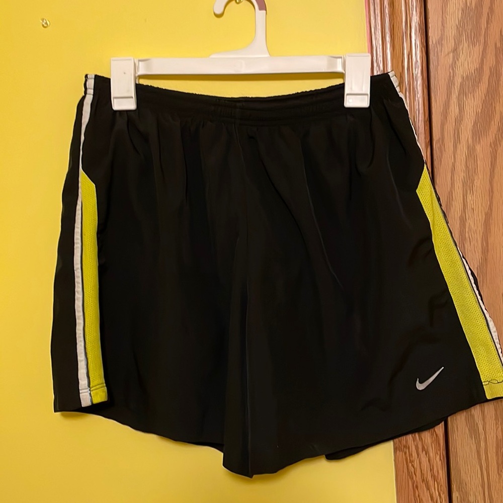Nike running shorts neon green stripe.